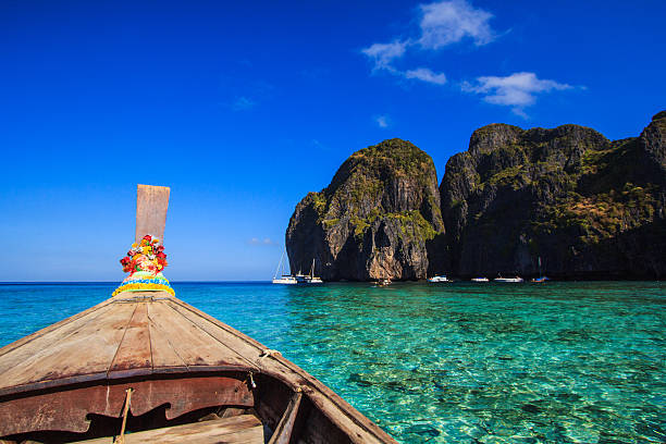 istock Ship Nose Front View Long tail boat at sea Thailand 185179121