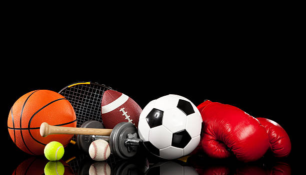 istock Assorted sports equipment on black 185179309