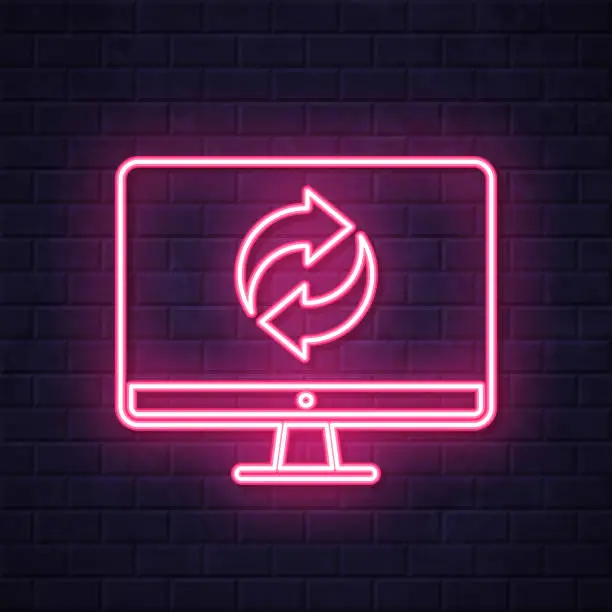 Vector illustration of Recycle symbol on desktop computer. Glowing neon icon on brick wall background