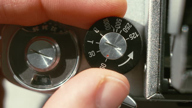 Adjusting SLR Single-lens reflex vintage film camera