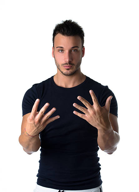 istock Handsome young man counting to nine with fingers and hands 185182294