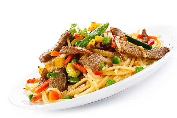 istock Pasta with grilled meat and vegetables 185182437