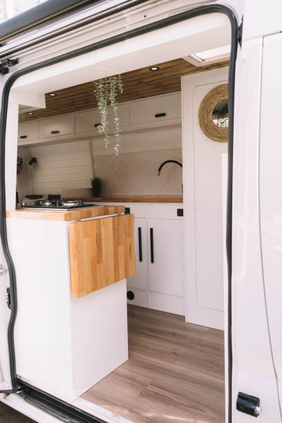Interior of a handcrafted camper van decorated in Nordic style stock photo