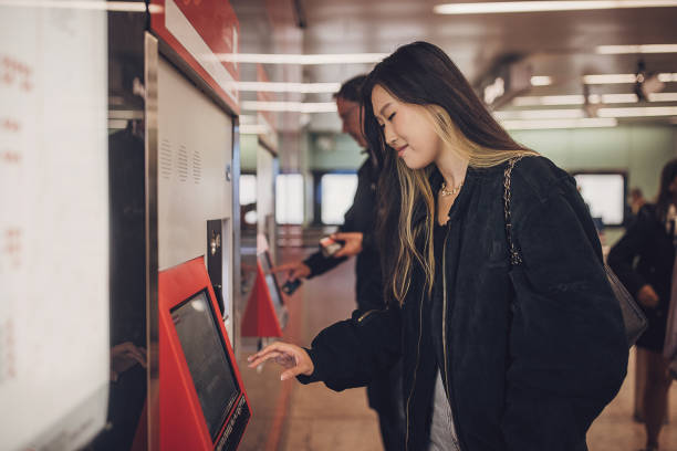 istock Woman buying a ticket for subway 1851844947
