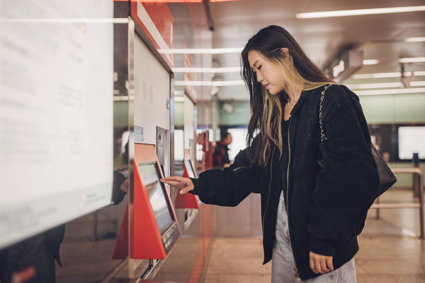 istock Woman buying a ticket for subway 1851846029