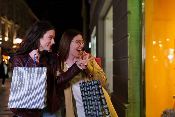 istock Two Female Friends Find Joy in Window Shopping Extravaganza 1851848949
