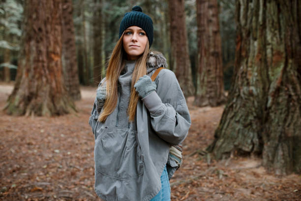istock Young woman walking in the forest 1851881082