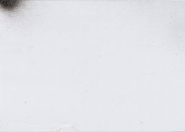 istock Black paint splatter texture resource in the upper left corner of the paper. Grungy grunge texture. Real paint splash, splattered with spray paint. 1851886278