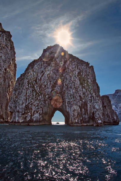 Rock gate in the sea, Punta di Tragara, Faraglioni, Capri, Gulf of Naples, Campania, Italy