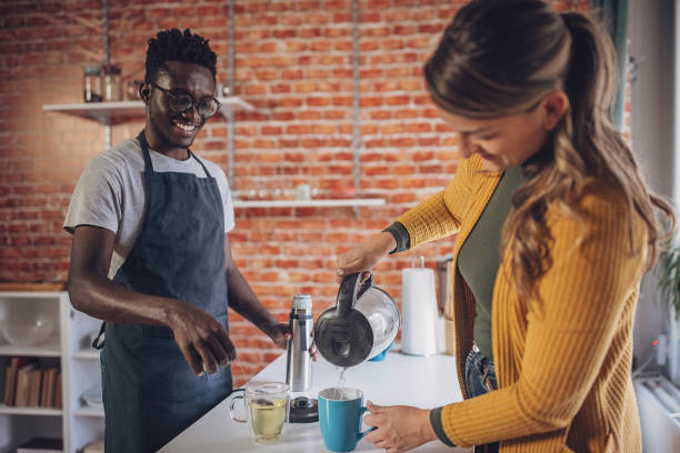 istock Young Couple Preparing Morning Tea 1851927833