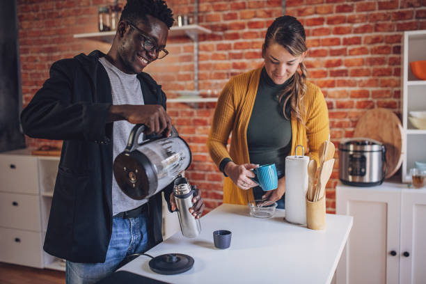 istock Interracial Couple Enjoying Coffee in Chic Kitchen 1851933065