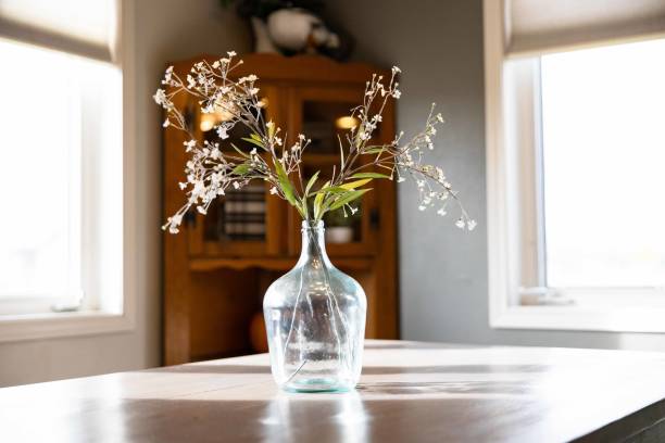 istock Glass vase filled with assorted wildflowers on the table 1851935016