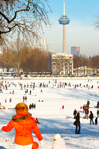 Cologne, Germany - 11. January 2009. The Aachener Weiher in Cologne, Germany. Lively activity on the frozen lake.