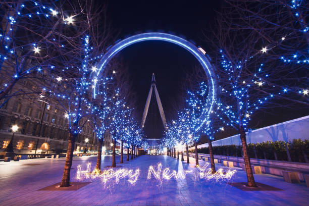 London, UK - Feb 1, 2012: Illuminated London Eye with inscription 'Happy New Year' in London, England, United Kingdom at night.