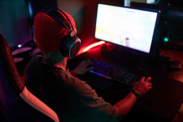 istock Gamer Playing Video Games with Red Neon Lights 1851950666