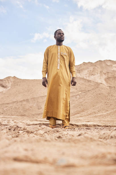 istock African American Man in Traditional Long Kaftan in Desert 1851959623