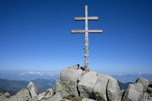 Cross on the highest hill of the Low Tatras with a view of the hills (dumbier-Slovakia).