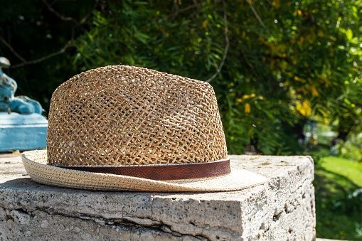 men's summer hat with a brim lies on the parapet. Journey. Spring is coming