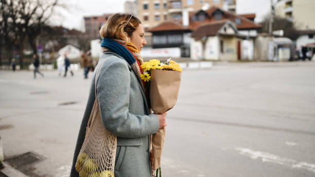 istock Young female coming back from grocery shopping 1851971309