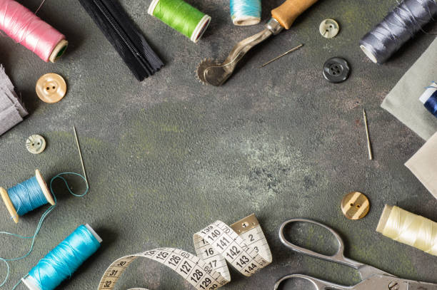 istock Tailor sewing accessories, craft concept background, scissors, tracing wheel, measure, threads 1851973987