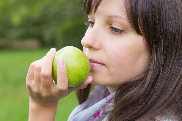 istock Girl and green apples 185197640