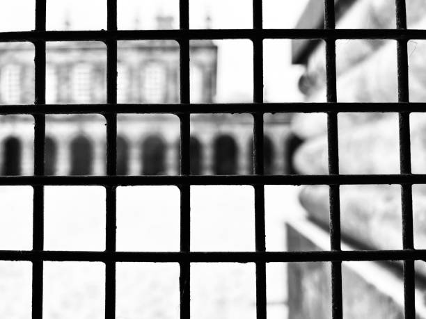 istock Looking through a metal fence at ancient architecture ruins 1851993194
