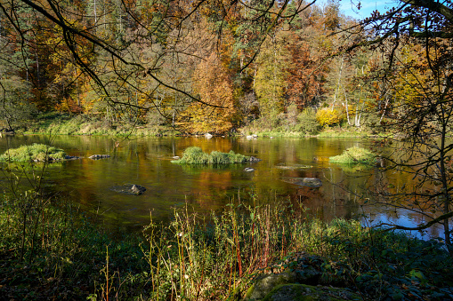 Autumn landscape at the rain river in Bavaria in late summer