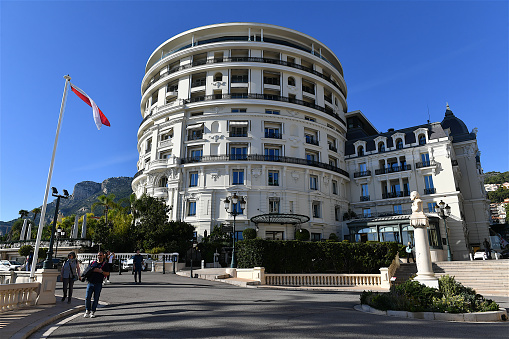 Monte-Carlo, Monaco-11 20 2023: Group of tourists in front of the luxurious Hotel de Paris in Monte-Carlo, Monaco.