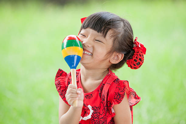 istock Asian little girl laughing with percussion 185202294