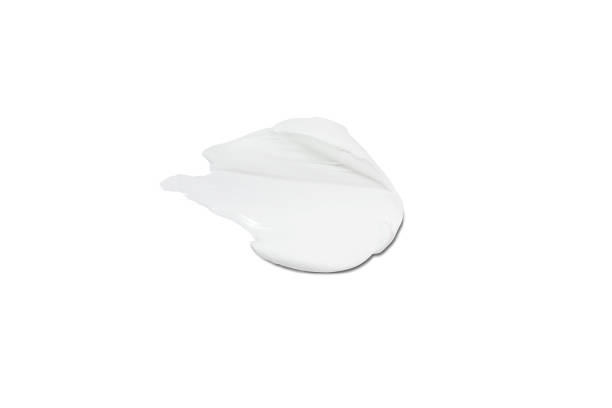 istock Liquid cream cosmetic smudge drops texture on white background. cosmetic smears cream texture. skin care product stroke flat lay, cream with hyaluronic acid 1852028060