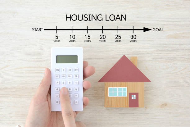 istock Human's hand using calculator and house object with housing loan indication bar 1852028135