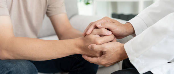 istock psychiatrist hold hand support each while discussing family issues. doctor encourages and empathy woman suffers depression. psychological, save divorce, Hand in hand together, trust, care 1852028399