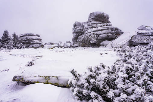 Frozen rock formation called Divci Kameny on Krkonosska magistrala in the Krkonose NP in winter.