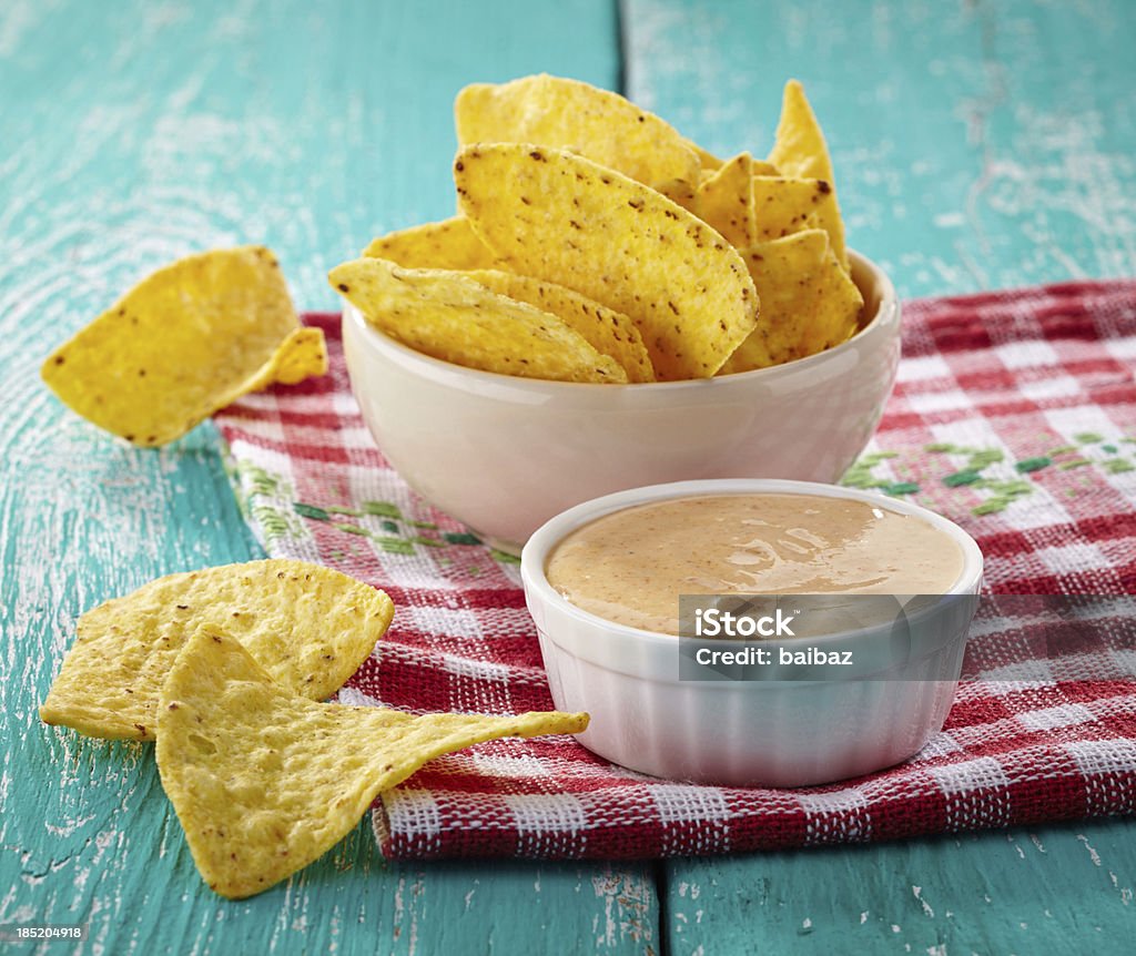 Nachos and dip Mexican nachos and dip on blue wooden background Appetizer Stock Photo