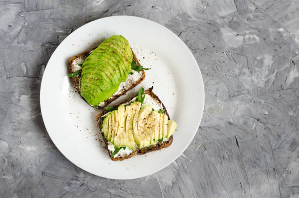 istock Healthy avocado toasts for breakfast or lunch with rye bread 1852054235