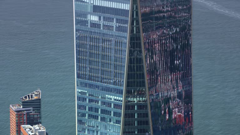 AERIAL One World Trade Center skyscraper, NYC on a sunny day