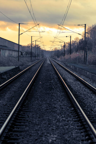 istock Perspective view of railroad tracks, at sunset 1852061220