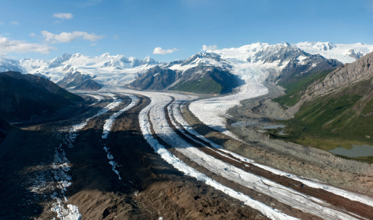 Panoramic aerial view of two sweeping glaciers merging near Kennecott in Wrangell - St Elias National Park