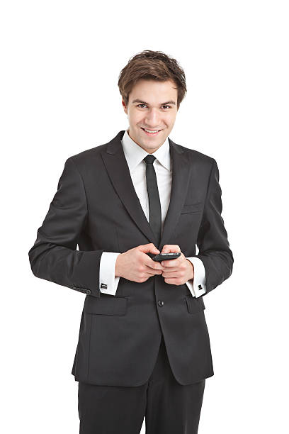 istock young handsome businessman on the phone 185207289