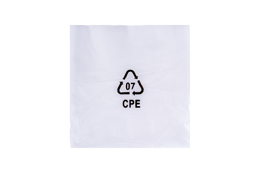 Soft plastic bag with recycle symbol isolated on white background.