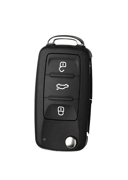 Modern automobile key Modern automobile Key and Remote Isolated on a White Background. keyring charm stock pictures, royalty-free photos & images