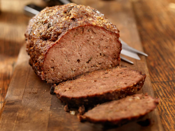 Meatloaf Meatloaf, Fresh from the oven on a cutting board -Photographed on Hasselblad H3D2-39mb Camera comfort food stock pictures, royalty-free photos & images