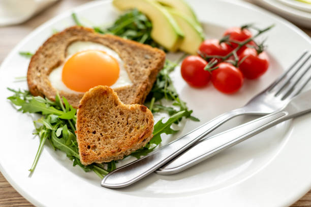 istock Egg in toast and heart shaped bread with vegetables 1852088132