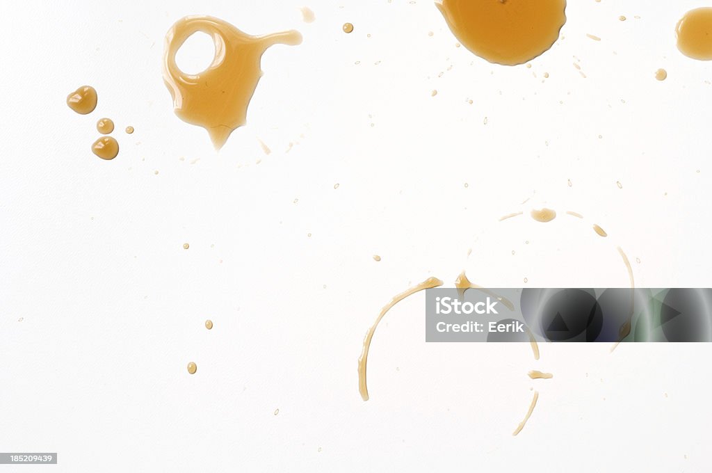 Coffee drips Spilled coffee drips on white table. Coffee - Drink Stock Photo