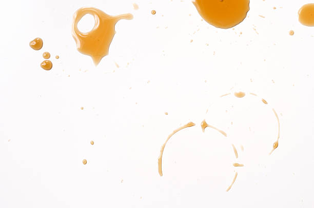 Coffee drips Spilled coffee drips on white table. spilling stock pictures, royalty-free photos & images