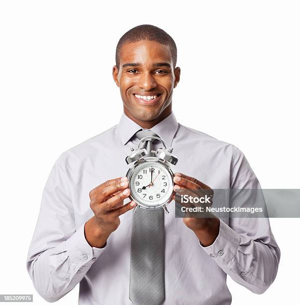 Businessman Holding An Alarm Clock Isolated Stock Photo - Download Image Now - 20-29 Years, Adult, Adults Only