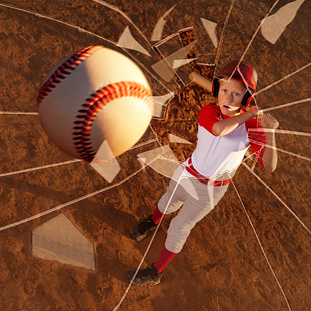 giocatore di baseball colpire la palla attraverso una finestra - baseballs baseball breaking broken foto e immagini stock