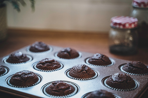 Homemade Sweet Chocolate Cupcakes on wooden table. Chocolate muffin.