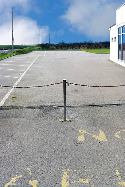 istock Empty Car Park With Chain Across Entrance 185212060