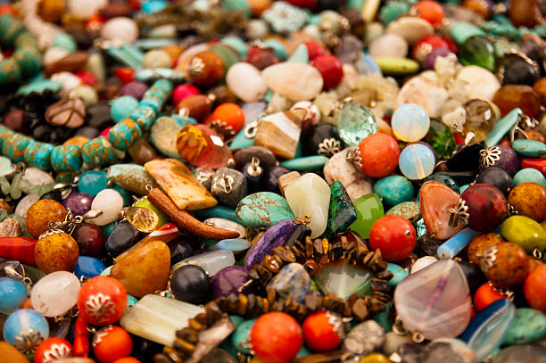 Heap of colorful bright stone jewelry jewellery and accessories on a street market  bead photos stock pictures, royalty-free photos & images